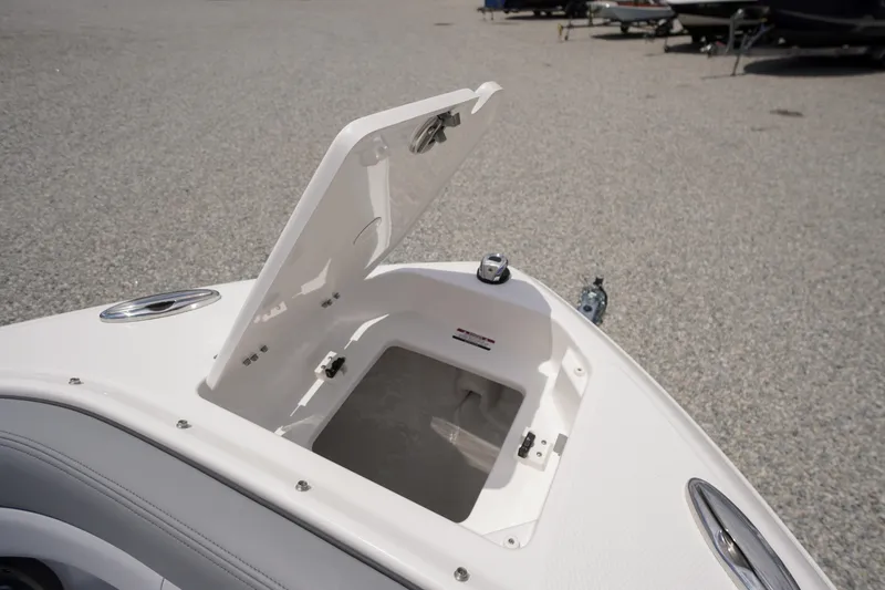 Slide: The Image of Open storage compartment on 2026 Chaparral SSX 4 boat, showcasing sleek design and functionality. - 11