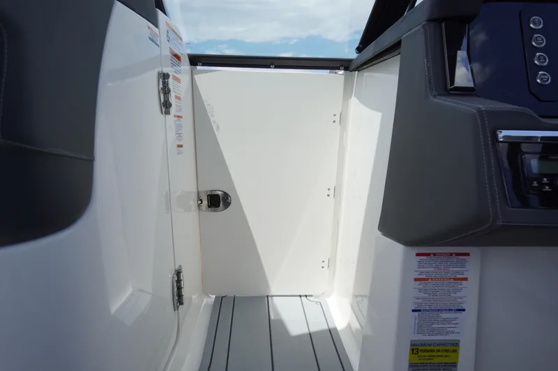 Slide: The Image of 2026 Chaparral SSX 4 boat interior, featuring sleek design and modern controls. - 21