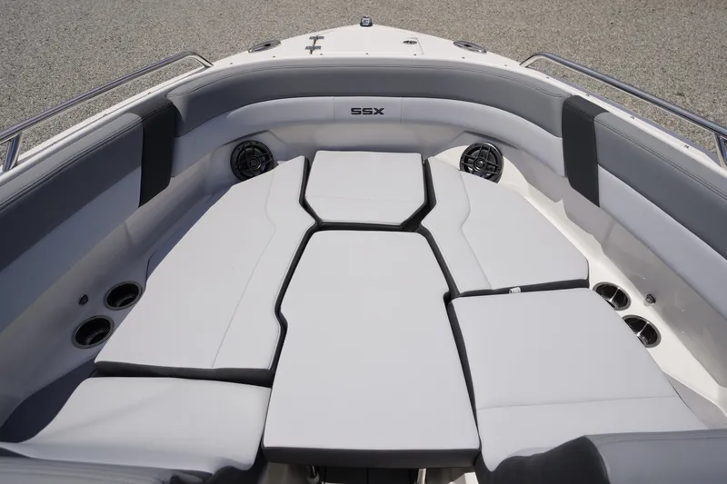 Slide: The Image of 2026 Chaparral SSX 4 boat interior with cushioned seating and cup holders. - 7