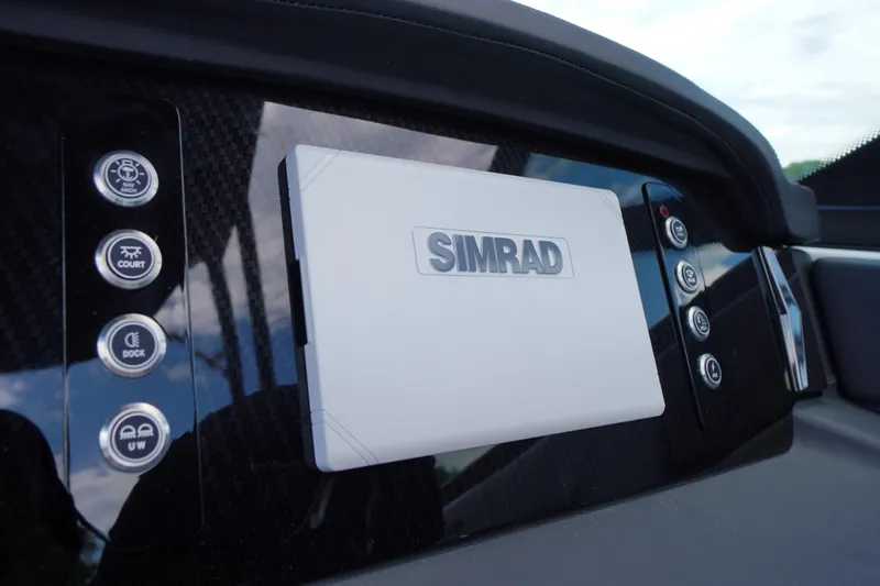Slide: The Image of Dashboard of 2026 Chaparral SSX 4 featuring Simrad navigation system. - 26