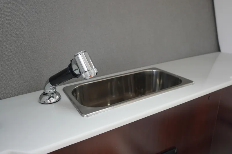 Slide: The Image of 2026 Chaparral SSX 4 boat interior with sleek sink and modern faucet design. - 44