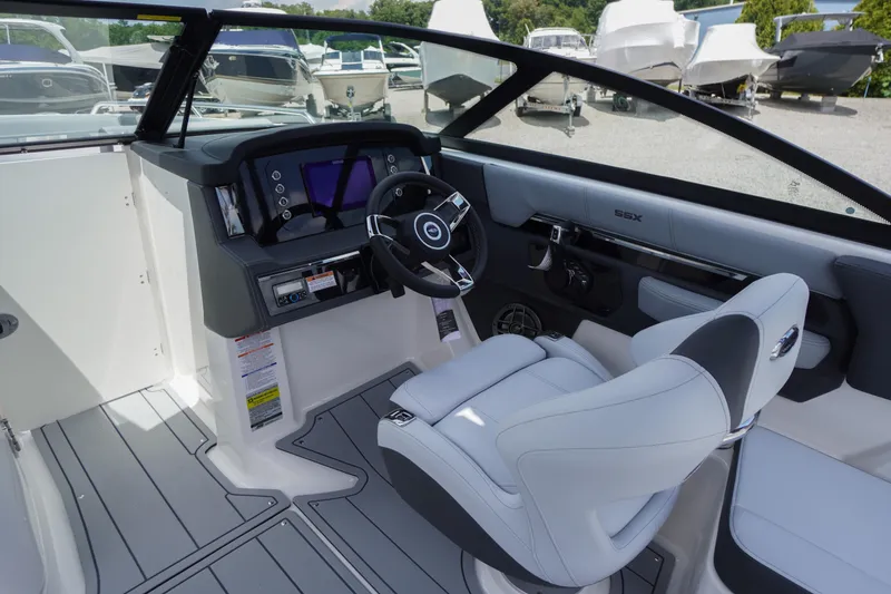 Slide: The Image of 2026 Chaparral SSX 4 boat interior with modern dashboard and steering wheel. - 23
