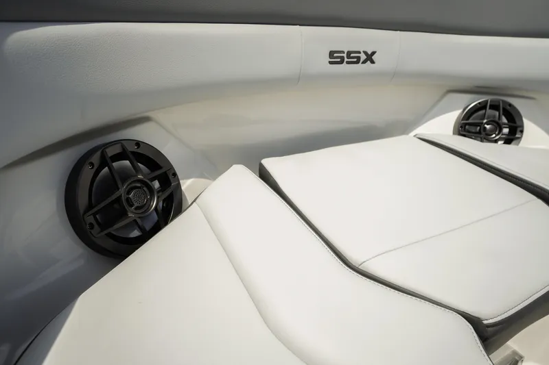 Slide: The Image of 2026 Chaparral SSX 4 boat interior with white seating and built-in speakers. - 10