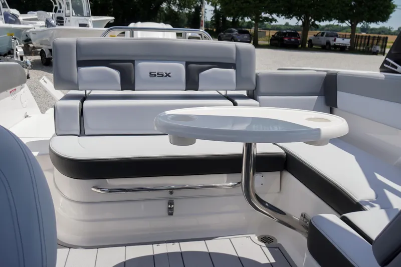 Slide: The Image of 2026 Chaparral SSX 4 boat interior with seating and table, showcasing luxury design. - 46