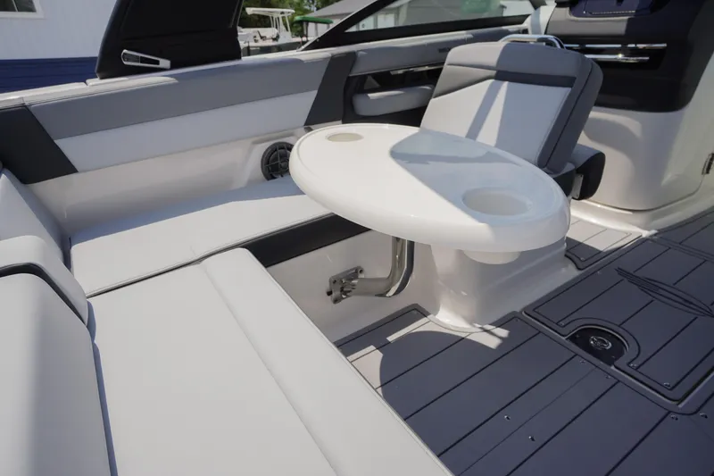 Slide: The Image of 2026 Chaparral SSX 4 boat interior with seating and a round table. - 48
