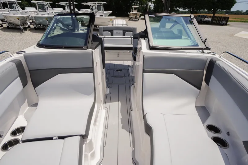 Slide: The Image of 2026 Chaparral SSX 4 boat interior with sleek seating and modern design. - 9