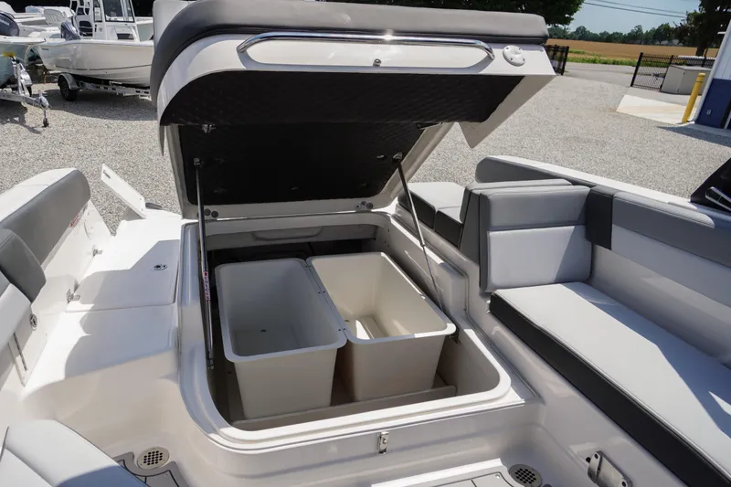 Slide: The Image of 2026 Chaparral SSX 4 boat interior with open storage compartment and seating. - 54