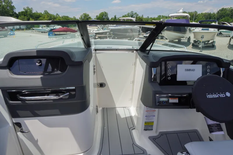 Slide: The Image of Interior view of 2026 Chaparral SSX 4 boat with modern dashboard and controls. - 20