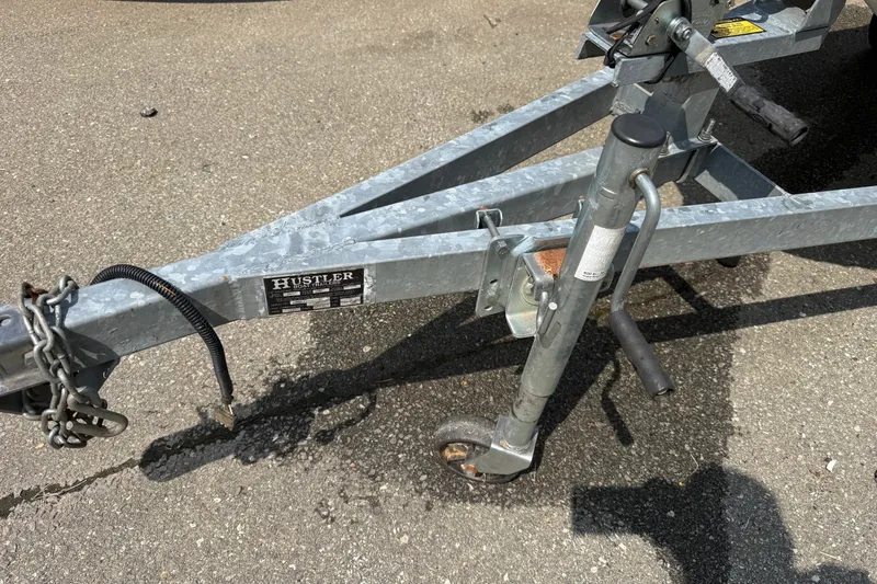 Slide: The Image of Trailer hitch and jack stand on pavement, compatible with 2005 Honda Aquatrax F-12. - 13