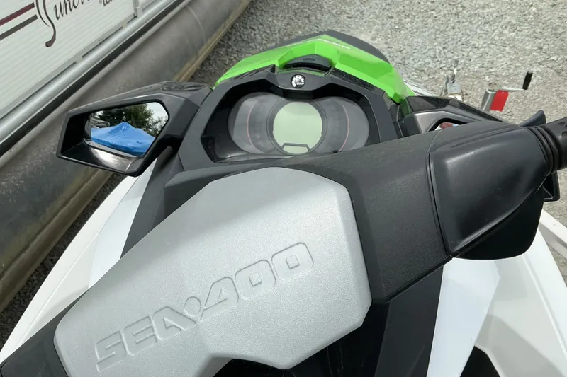 Slide: The Image of 2013 Sea-Doo GTI SE 130 dashboard with mirrors and controls, close-up view. - 7