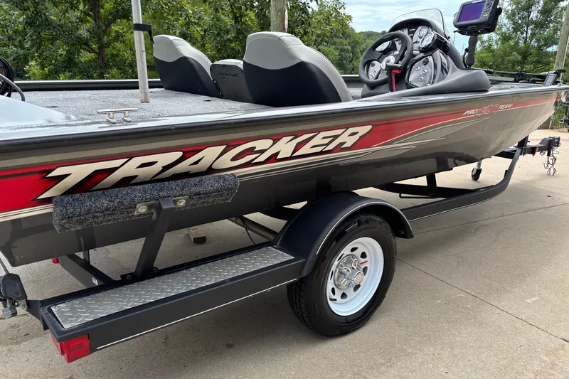 Slide: The Image of 2018 Tracker Pro Team 190 TX boat on trailer, featuring sleek design and modern dashboard. - 8