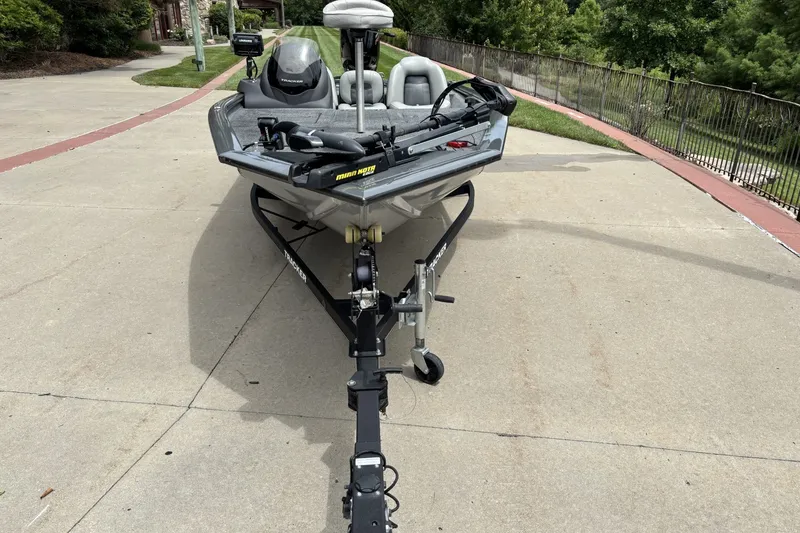 Slide: The Image of 2018 Tracker Pro Team 190 TX fishing boat on trailer, parked on concrete driveway. - 3