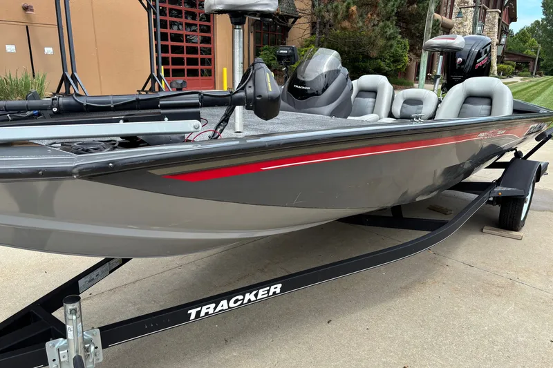 Slide: The Image of 2018 Tracker Pro Team 190 TX boat on trailer, gray with red accents. - 10