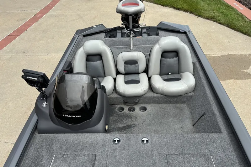 Slide: The Image of 2018 Tracker Pro Team 190 TX boat interior with gray seating and Lowrance fishfinder. - 6