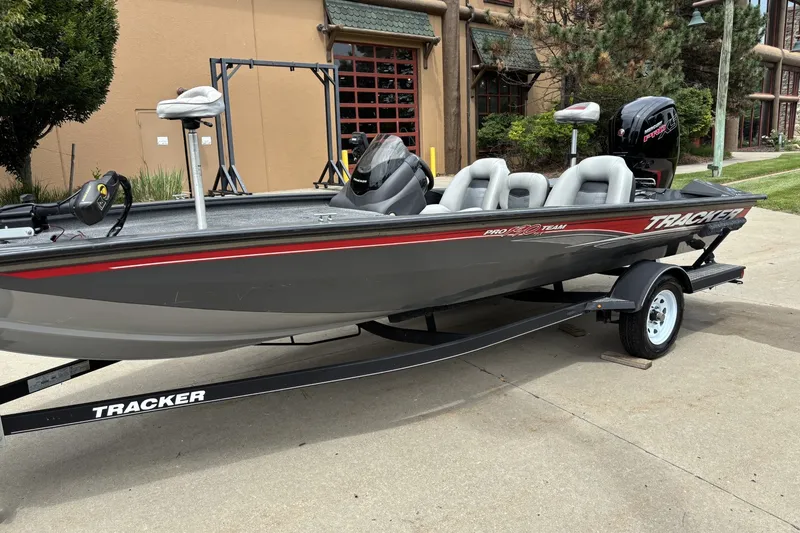 Slide: The Image of 2018 Tracker Pro Team 190 TX fishing boat on trailer, parked outdoors. - 4