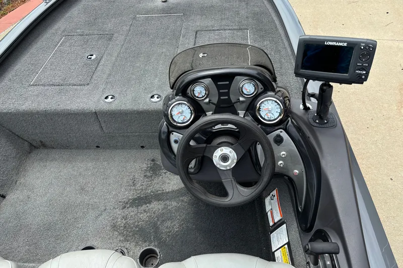 Slide: The Image of 2018 Tracker Pro Team 190 TX boat dashboard with steering wheel and Lowrance fishfinder. - 7