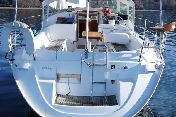 Slide: The Image of 1999 Jeanneau Sun Odyssey 40 DS sailboat with spacious deck and seating area. - 3