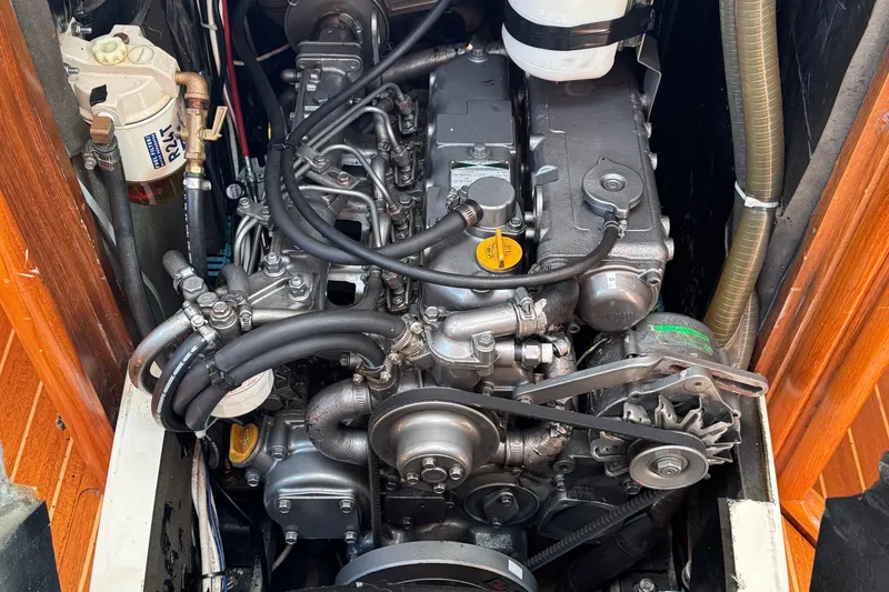 Slide: The Image of Engine compartment of a 1999 Jeanneau Sun Odyssey 40 DS sailboat, showcasing detailed mechanics. - 19