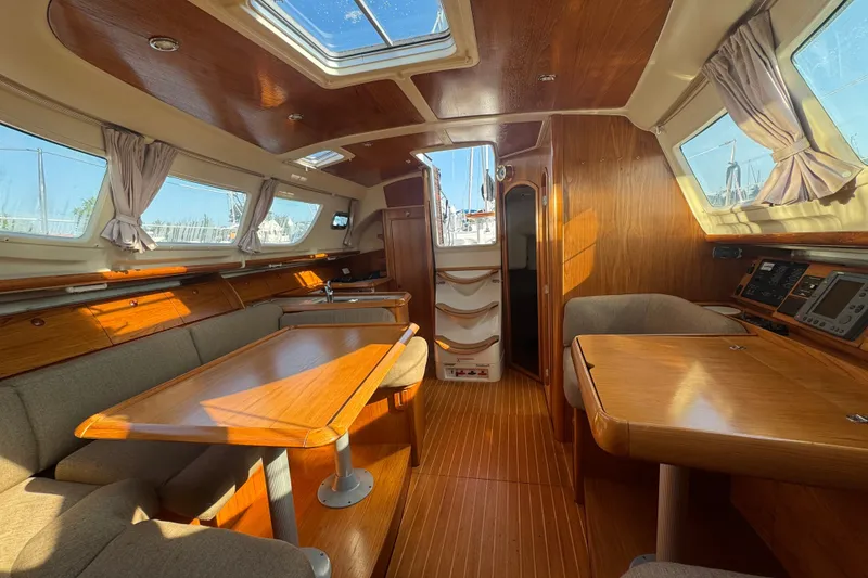 Slide: The Image of Interior of 1999 Jeanneau Sun Odyssey 40 DS yacht with wooden furnishings and ample natural light. - 12