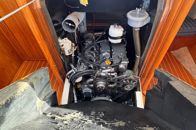 Slide: The Image of Engine compartment of a 1999 Jeanneau Sun Odyssey 40 DS sailboat, showcasing detailed mechanics. - 20