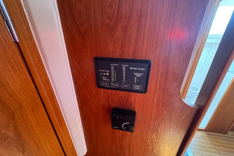 Slide: The Image of Control panel on Jeanneau Sun Odyssey 40 DS yacht, 1999 model, with wooden interior. - 11
