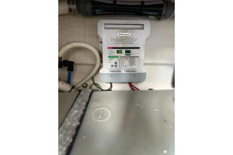 Slide: The Image of ProMariner ProNautic 12-30P charger in 2021 Regal 28 Express boat engine compartment. - 7