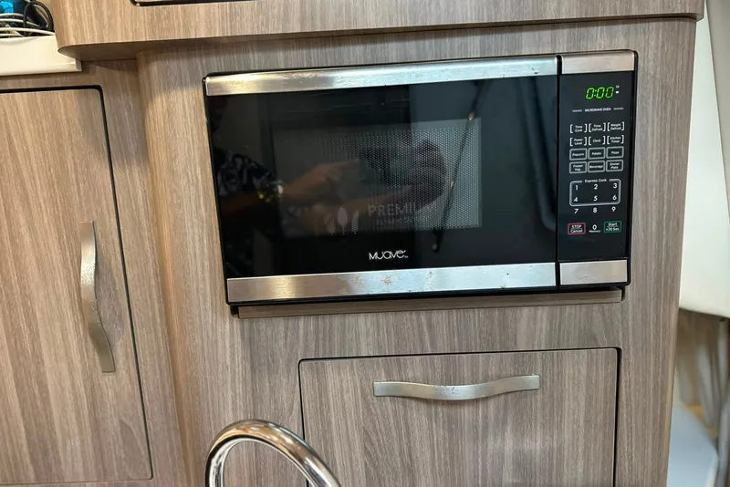Slide: The Image of Microwave oven in 2021 Regal 28 Express boat kitchen interior. - 15