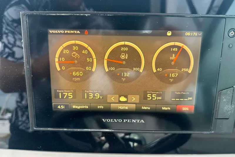 Slide: The Image of Volvo Penta engine display on 2021 Regal 28 Express showing RPM, temperature, and oil pressure. - 41