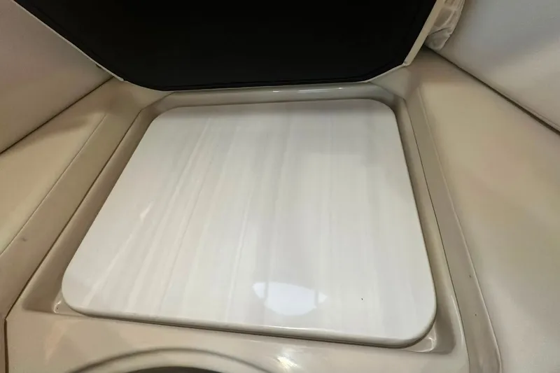 Slide: The Image of Interior view of 2021 Regal 28 Express boat cabin with closed hatch. - 28