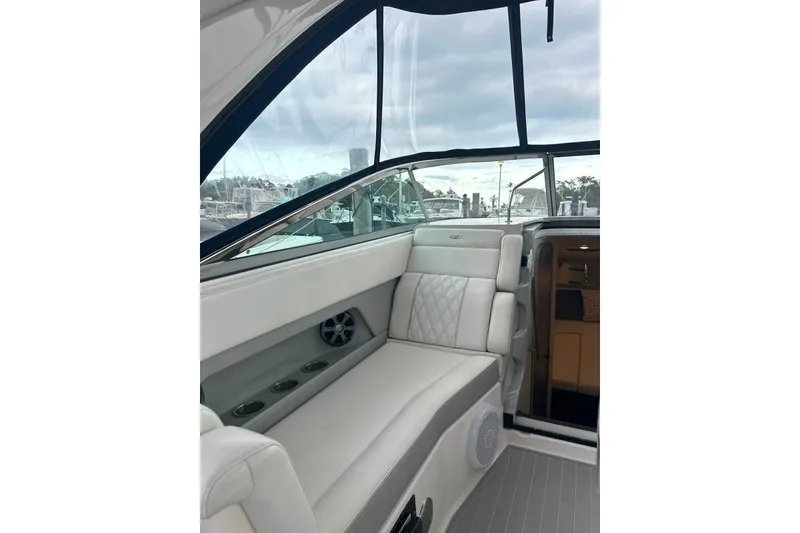 Slide: The Image of Interior of 2021 Regal 28 Express boat with luxurious seating and modern design. - 37