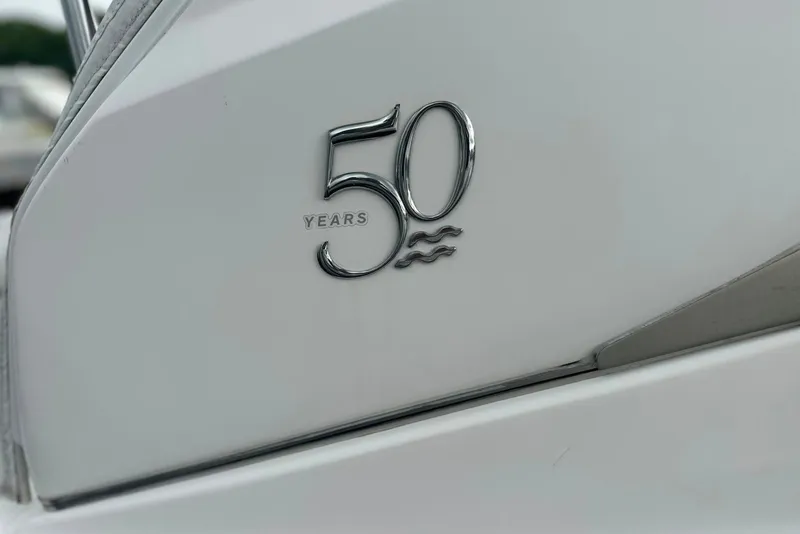 Slide: The Image of Regal 28 Express 2021 boat, 50th anniversary emblem on white hull. - 31
