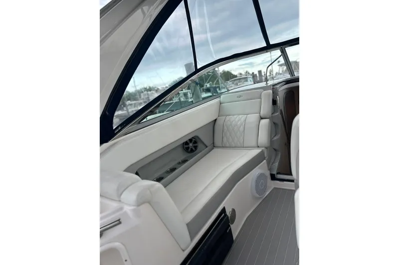 Slide: The Image of 2021 Regal 28 Express boat interior with luxurious white seating and modern design. - 17