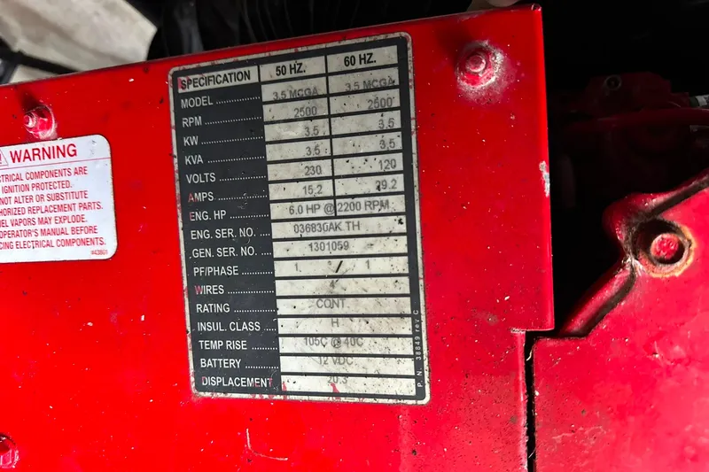 Slide: The Image of Red engine specification label on a 2021 Regal 28 Express boat. - 40