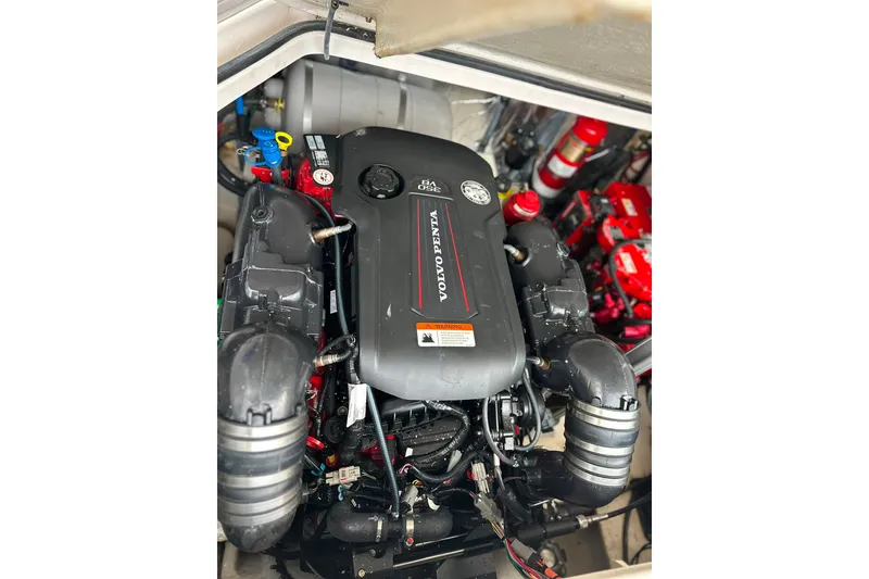 Slide: The Image of Engine compartment of a 2021 Regal 28 Express boat featuring a Volvo Penta engine. - 43