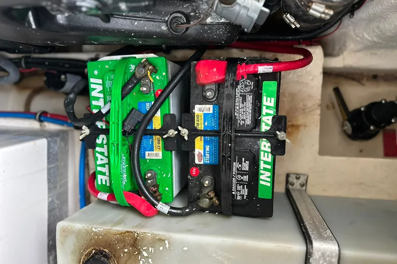 Slide: The Image of Battery compartment of a 2021 Regal 28 Express boat with Interstate batteries. - 6