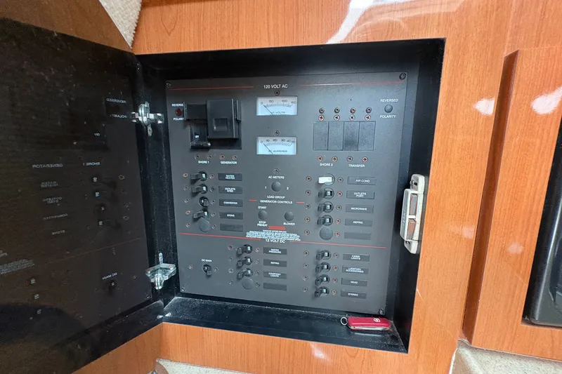 Slide: The Image of Electrical panel of 2003 Wellcraft 270 Coastal I/O boat with switches and meters. - 11