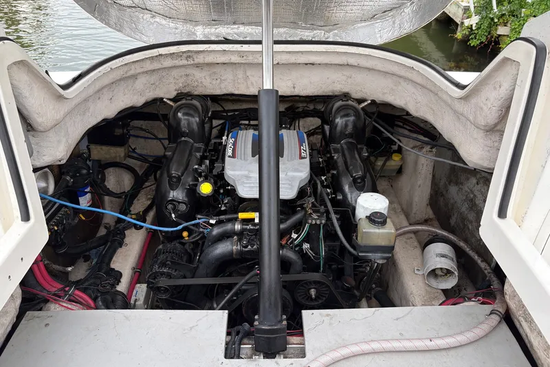 Slide: The Image of 2003 Wellcraft 270 Coastal I/O engine compartment with visible components and wiring. - 16