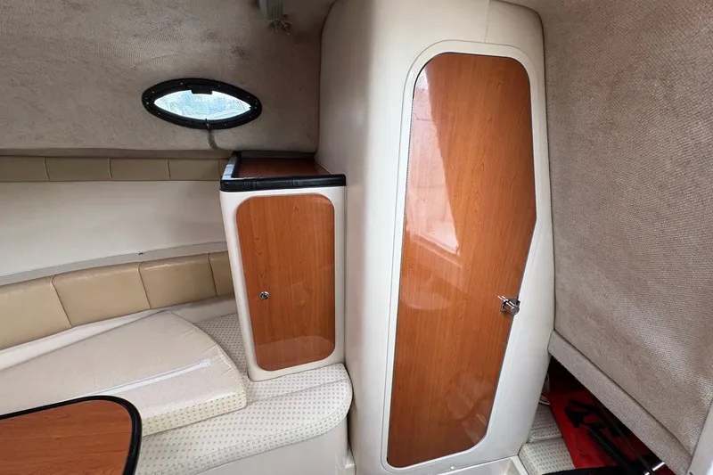 Slide: The Image of Interior cabin of 2003 Wellcraft 270 Coastal I/O with wood cabinetry and seating. - 13
