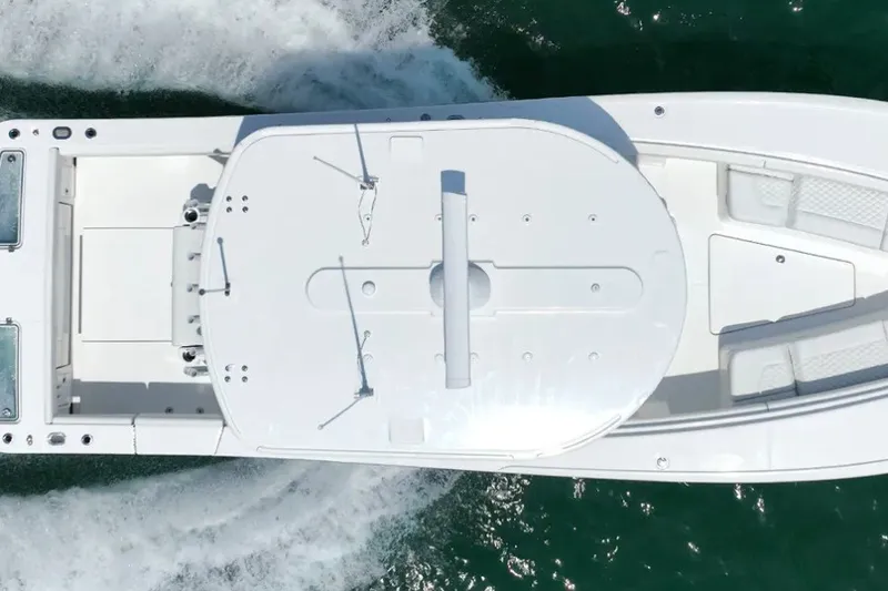 Slide: The Image of Aerial view of 2027 Regulator 31 boat cruising on water. - 1