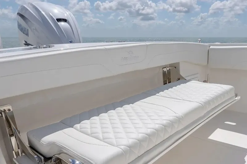 Slide: The Image of Luxurious seating on 2027 Regulator 31 boat with Yamaha engine, ocean view. - 4