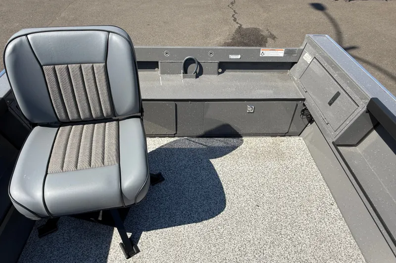 Slide: The Image of 2026 Alumaweld Free Drifter 20 boat interior with gray seating and storage compartments. - 22