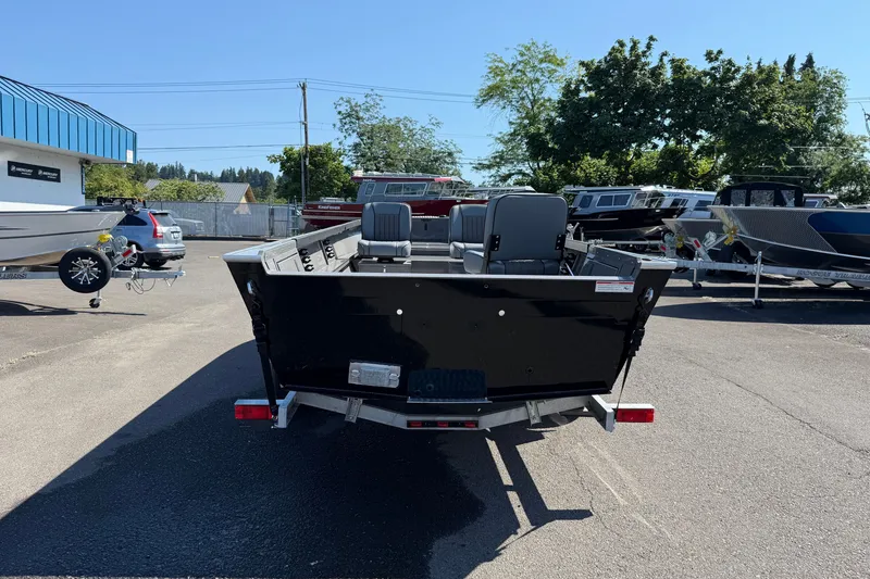 Slide: The Image of 2026 Alumaweld Free Drifter 20 boat, rear view in a parking lot. - 3