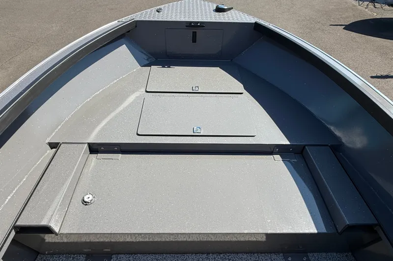Slide: The Image of 2026 Alumaweld Free Drifter 20 boat interior with storage compartments and sleek design. - 14