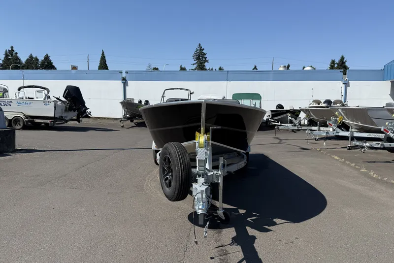 Slide: The Image of 2026 Alumaweld Free Drifter 20 boat on trailer in outdoor lot. - 2