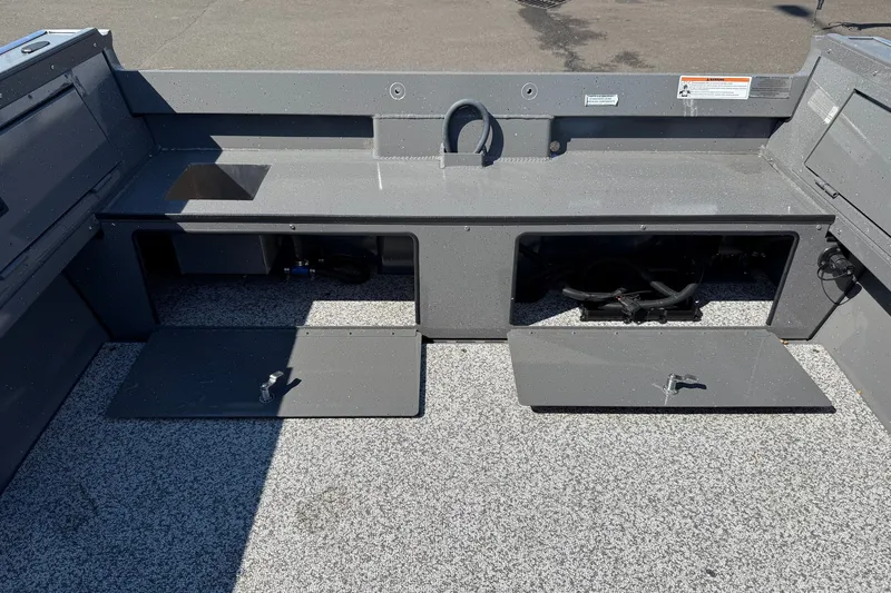 Slide: The Image of 2026 Alumaweld Free Drifter 20 boat interior with open storage compartments. - 5