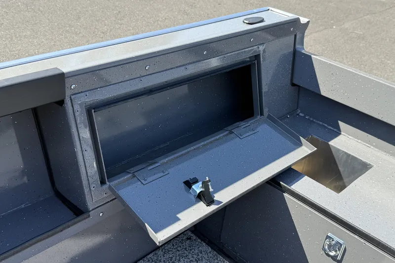 Slide: The Image of 2026 Alumaweld Free Drifter 20 boat storage compartment with open hatch, showcasing sleek design. - 10