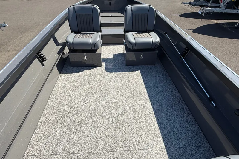 Slide: The Image of 2026 Alumaweld Free Drifter 20 boat interior with two gray seats and spacious deck. - 13