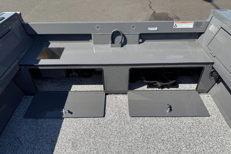 Slide: The Image of 2026 Alumaweld Free Drifter 20 boat interior with storage compartments and gray finish. - 28