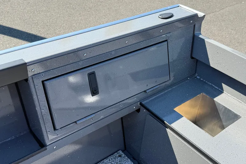 Slide: The Image of 2026 Alumaweld Free Drifter 20 boat interior with storage compartment and metallic finish. - 6