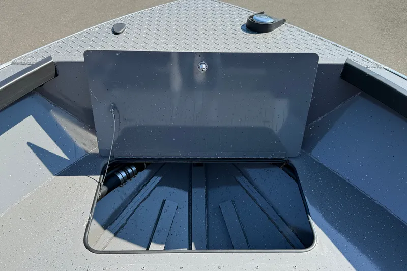 Slide: The Image of 2026 Alumaweld Free Drifter 20 boat interior with storage compartment open. - 18
